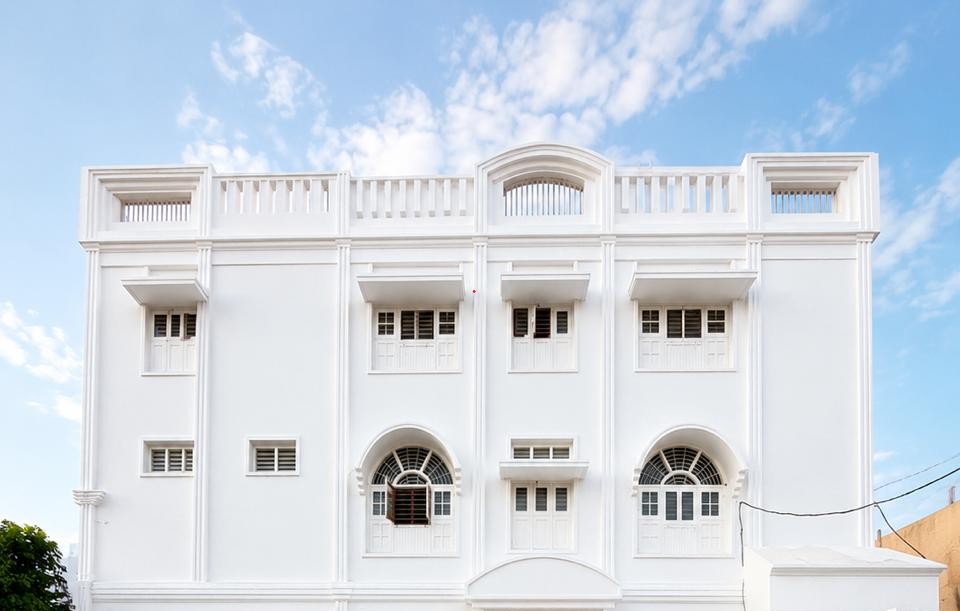White architectural building under a blue sky